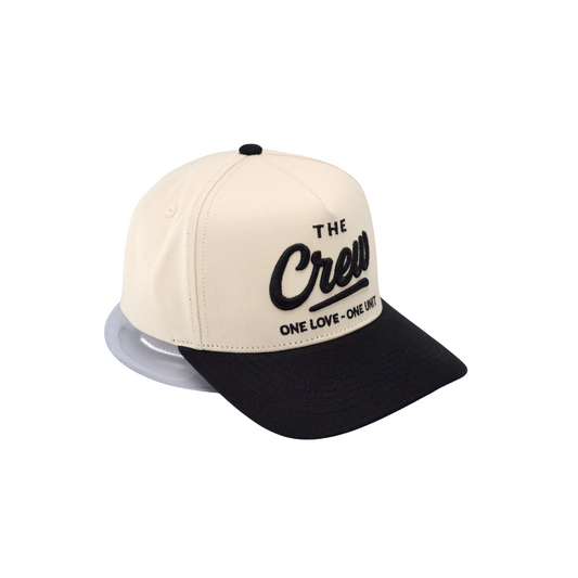 Two-tone cap with 'The Crew' logo on a white background