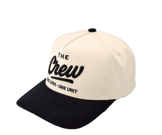 Two-tone cap with 'The Crew' logo on a white background